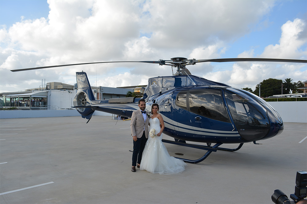 Wedding couple with Helicopter